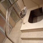 Custom-bent 40 mm polished 316 stainless-steel pool handrail installed at Virgin Active