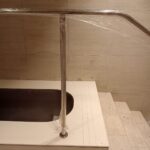 Custom-bent 40 mm polished 316 stainless-steel pool handrail installed at Virgin Active